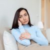 Sad depressed tired lonely divorced ill mother asian woman feeling unwell, unhealthy, suffering from midlife crisis on lockdown, social distance